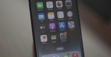 a cell phone sitting on top of a wooden table